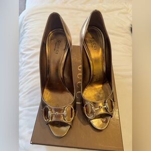 Gold Gucci high heel peep toe pump. Size 37.5